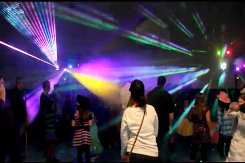 School Laser Light Show, Hamilton DJ, Family Dance, guests dancing with laser beams & special  effects beams  everywhere, blue, red, green, pink & yellow.  Taken in Hamilton.